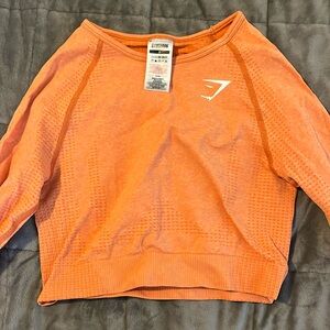 Long Sleeve Orange Gymshark cropped workout shirt